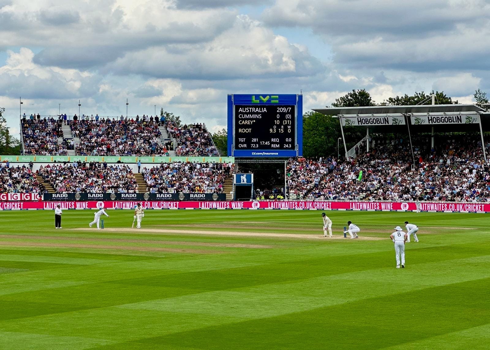 Panoramic shot as Root bowls to Carey with Australia at 209-7