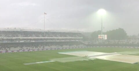 Floodlight through mist with rain sodden pitch