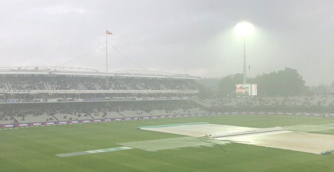 Floodlight through mist with rain sodden pitch